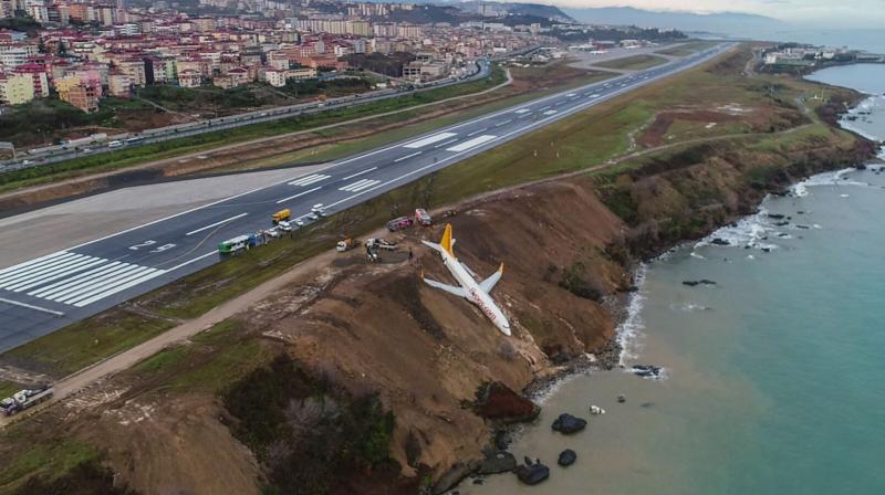 Passenger plane skids off runway in northern Turkey, gets stuck on cliff edge