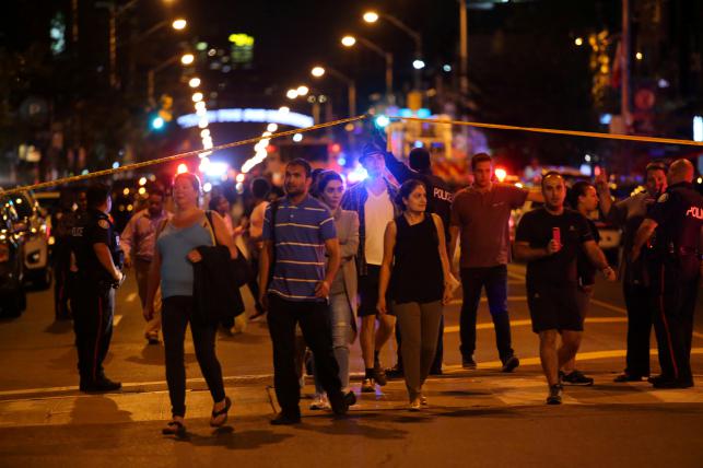 Toronto shooting kills 2 including gunman, 13 injured
