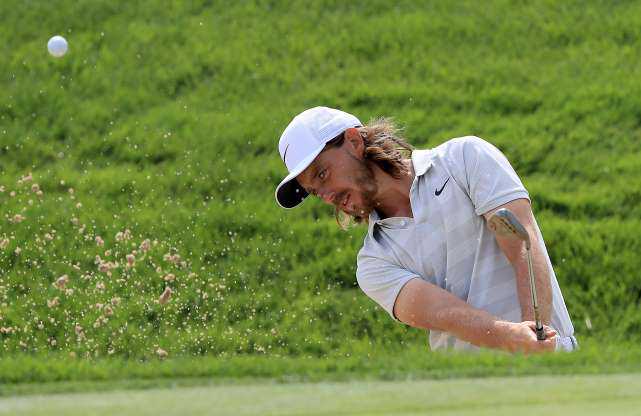 Tommy Fleetwood plays a shot from the bunker during a practice round prior to the WGC-Bridgestone Invitational in Akron