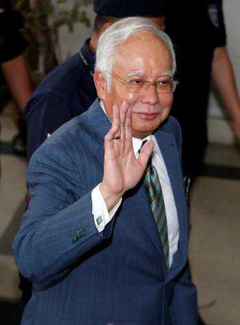 Najib Razak charged over money laundering