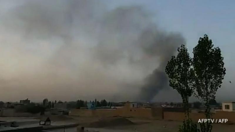 US launches airstrikes as Taliban attack Afghan city