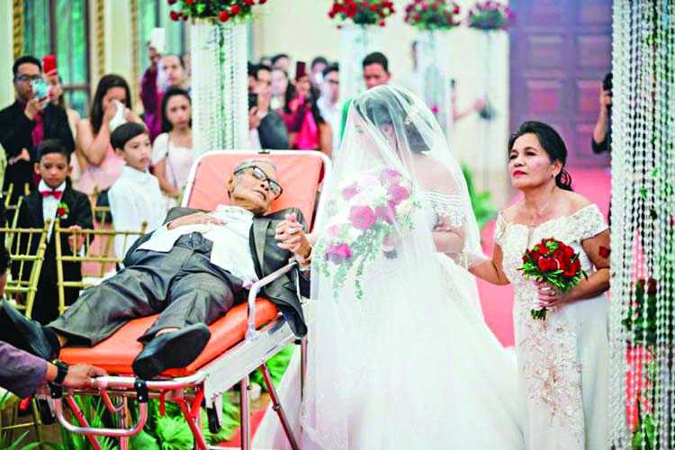Dying father walks daughter down the aisle