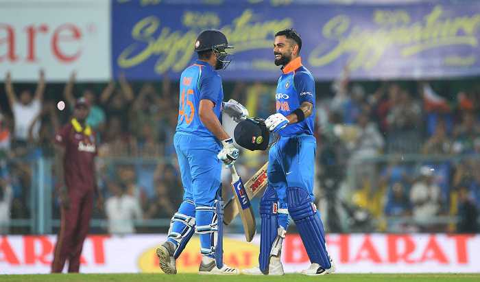 Kohli, Sharma tons crush West Indies in 1st ODI