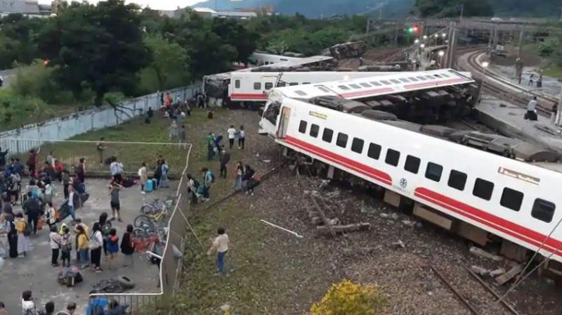 18 killed in Taiwan after train derails and flips over, 160 injured