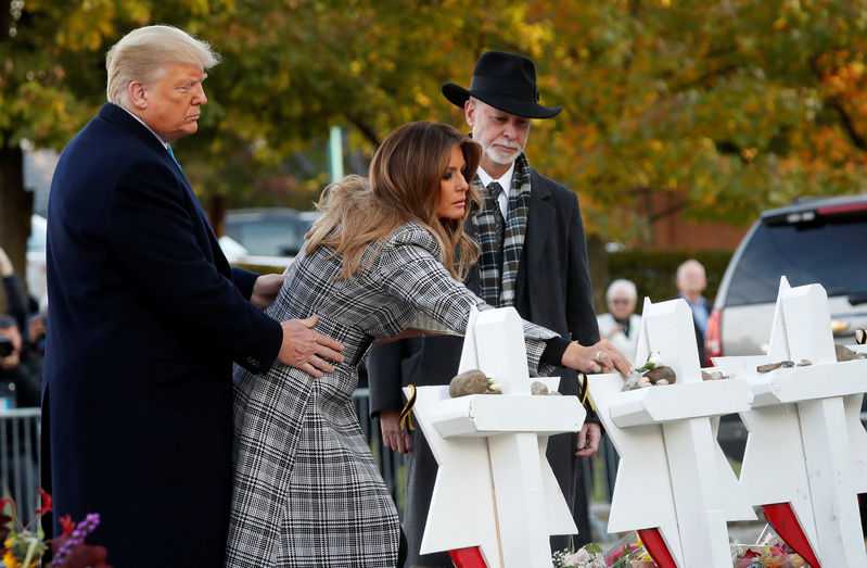 President visits Pittsburgh to console but also stirs anger
