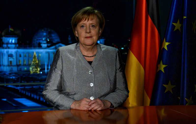 Merkel urges divided Germans to pull together