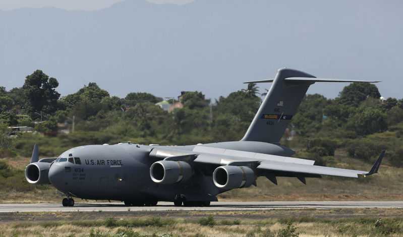 U.S. military planes land near Venezuela border with aid