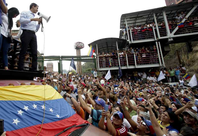 Rival Venezuela factions rally as blackouts persist