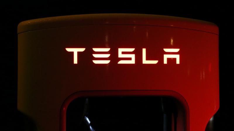 Tesla's Musk 'sees merit' in capital raise, vows profit in Q3 after large loss