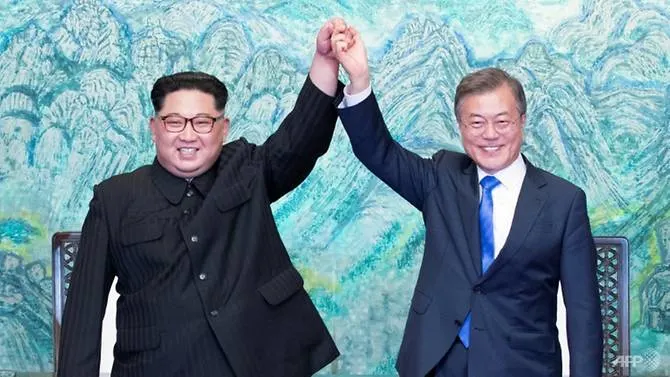 Two Koreas mark Moon-Kim summit anniversary with different tones