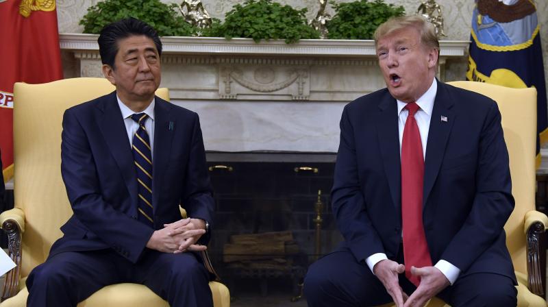 In midst of trade talks, Donald Trump takes Shinzo Abe for golf rematch