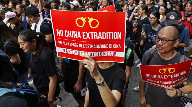 Protests still underway despite suspension of controversial bill in Hong Kong