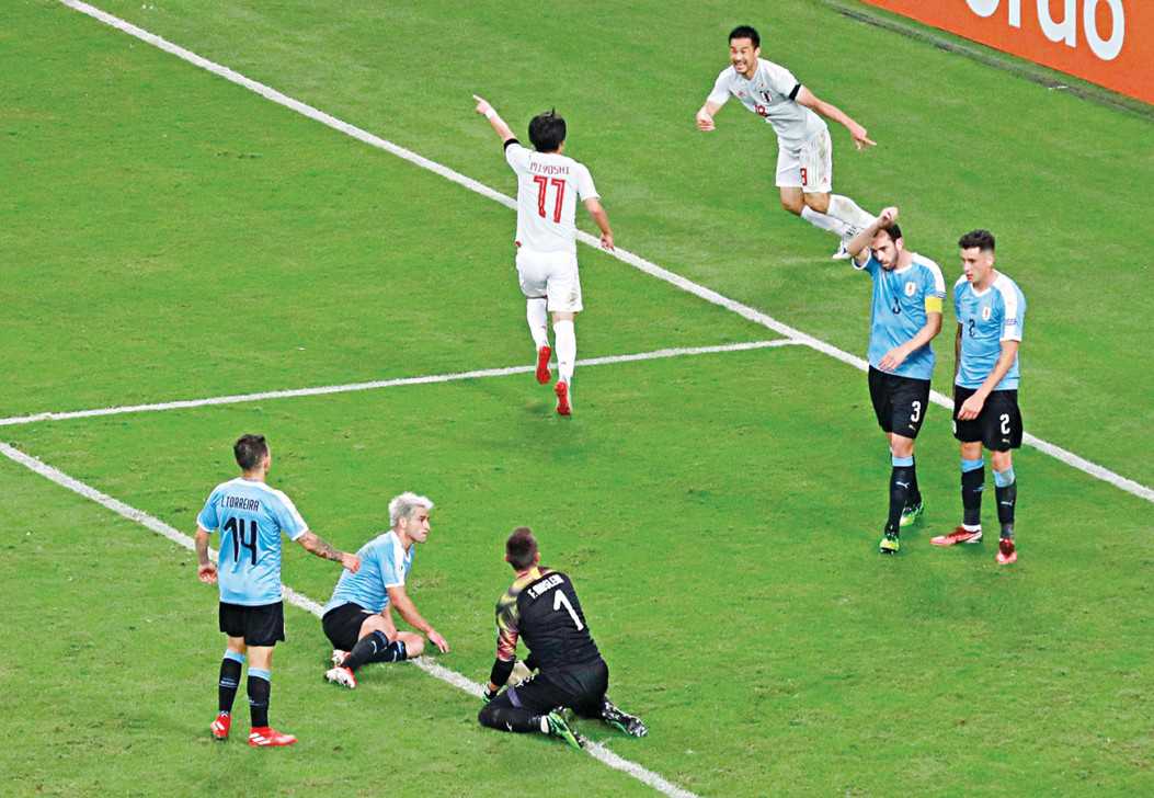 Japan, Uruguay draw after VAR controversy