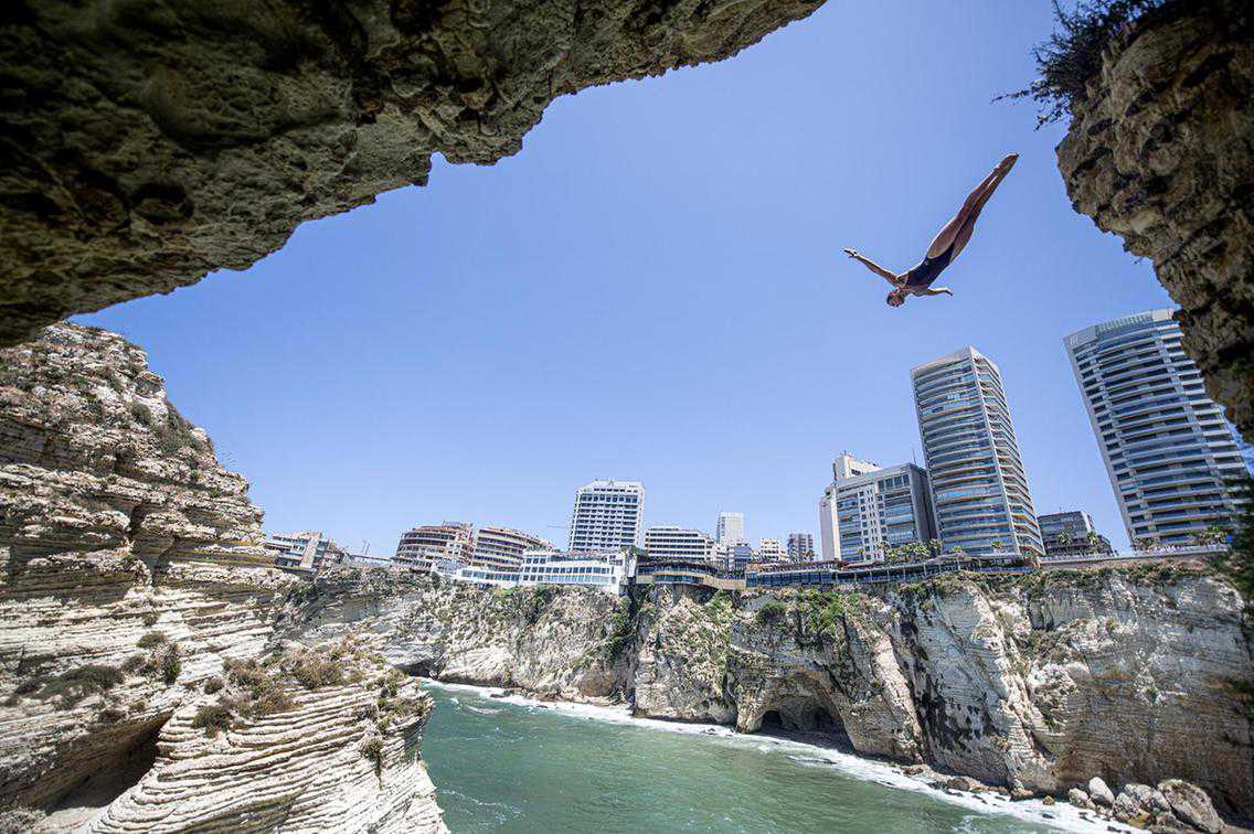 Divers plunge from Lebanon's famous Pigeon Rocks in Beirut