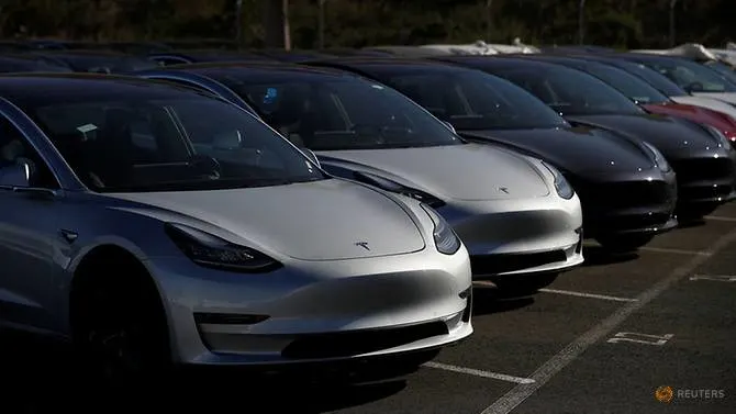 Tesla cuts price of mass-marked Model 3, lifts prices of premium EVs