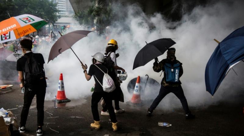 Police fire tear gas at Hong Kongers defying ban on 'anti-triad' rally