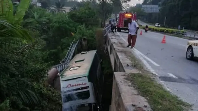 Tour bus skids off bridge in Malaysia, three injured
