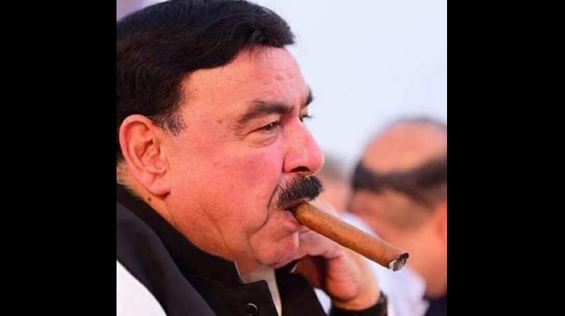 Pakistan minister Sheikh Rashid Ahmad pelted with eggs, punched in London