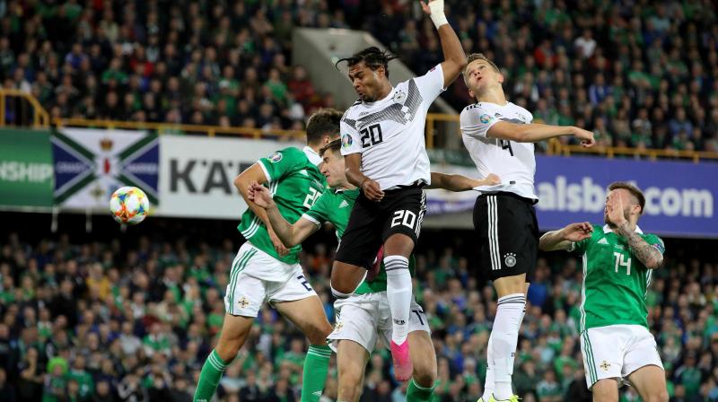 Germany routs Ireland 2-0, tops group
