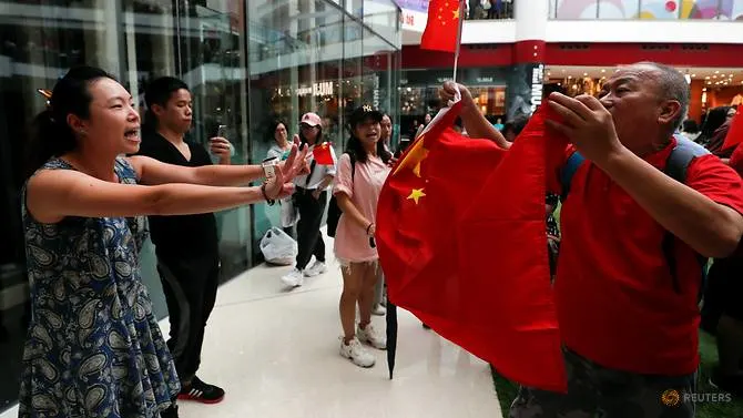 Beijing supporters face off against demonstrators in Hong Kong shopping mall