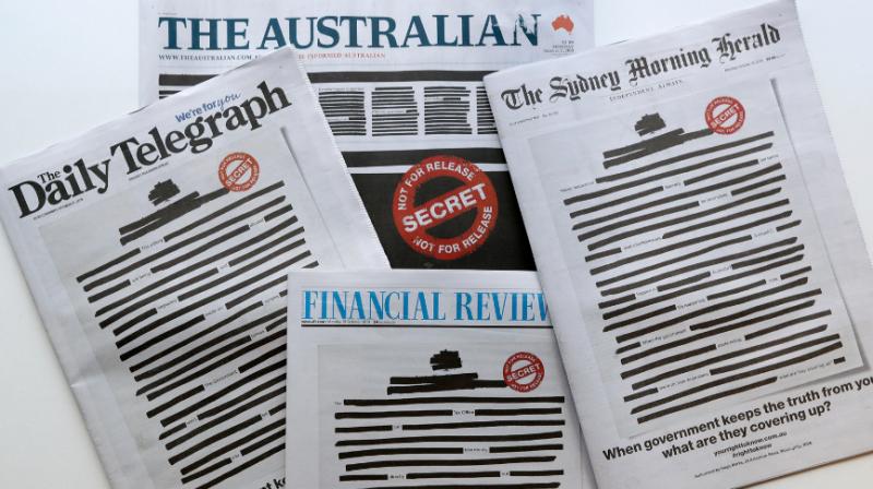 In fight for press freedom, Australian newspapers redact front pages to expose govt