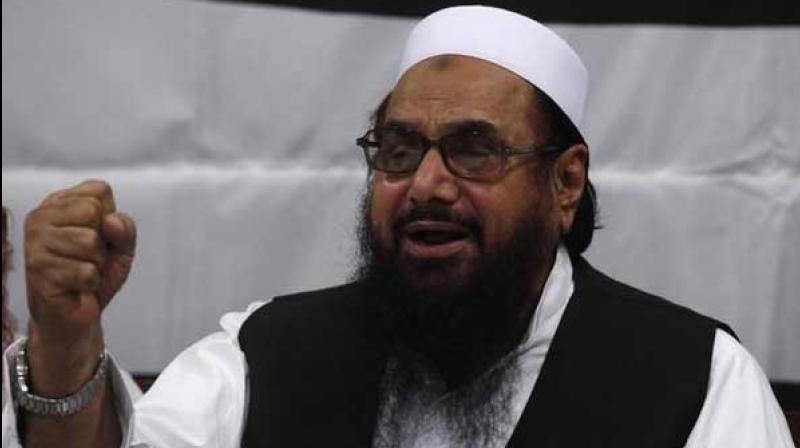Pakistan court acquits police officials accused of killing ATM thief after Hafiz Saeed mediation