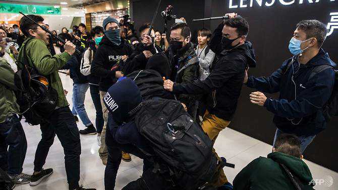 Hong Kong police use batons, pepper spray on protesters after clashes in shopping mall