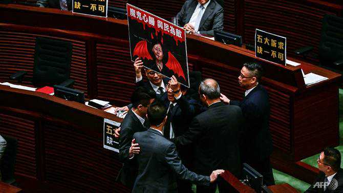 Hong Kong opposition lawmakers ejected for heckling leader