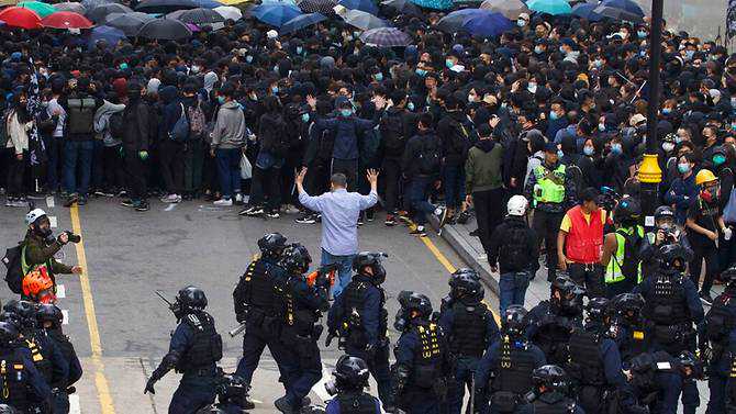 Police arrest organiser of Hong Kong protest after rally turns violent