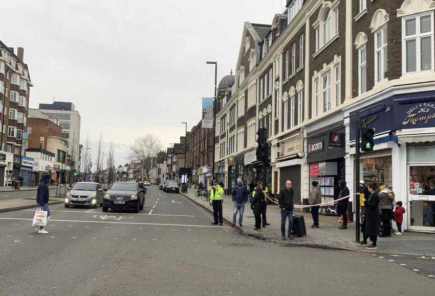 Man wearing fake bomb stabs 2 in London; shot dead by police