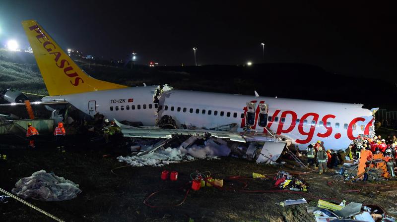 Plane breaks into three after skidding off Istanbul runway