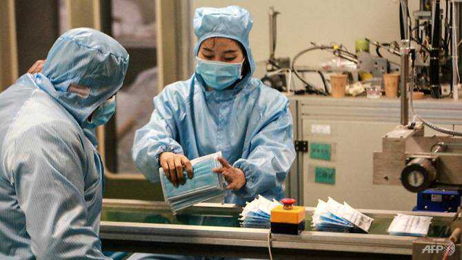 With China needing virus masks, phone and diaper makers fill void