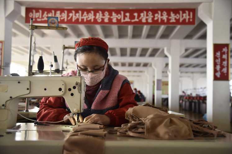 China factory activity unexpectedly expands, but economy unable to get rid of virus shock