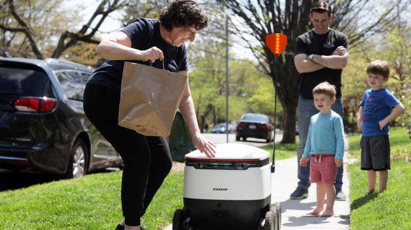 Robots and drones pick up delivery jobs in the West as humans face coronavirus risk