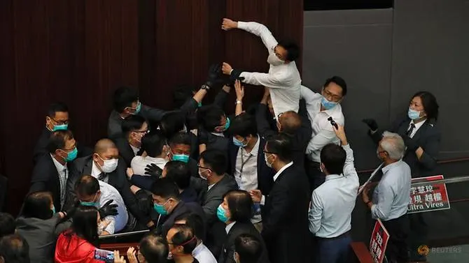 Pro-Beijing lawmakers, democrats clash in Hong Kong legislature