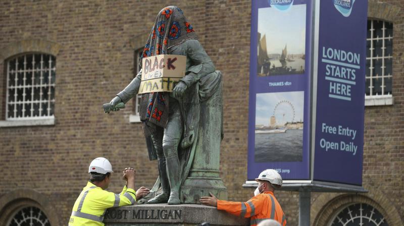 Authorities remove slave trader statue in London