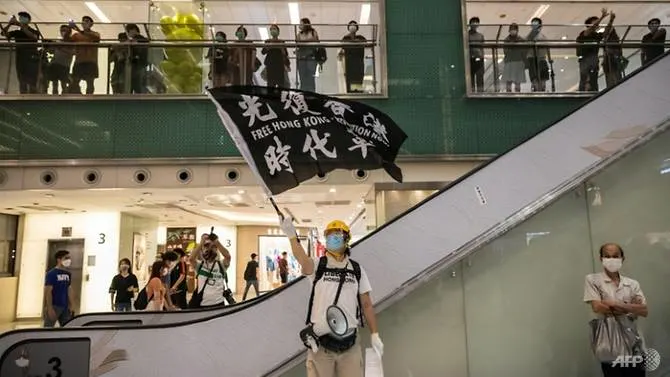 Hong Kongers sing protest anthem one year after major clashes
