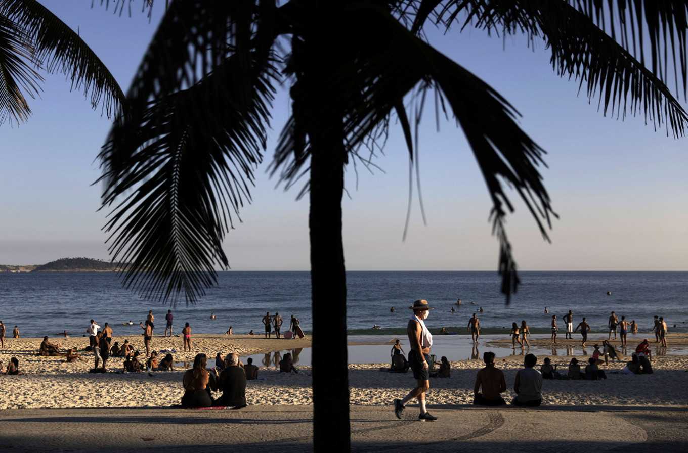 Brazilians flock to beach seeing that WHO says country undercounting coronavirus surge