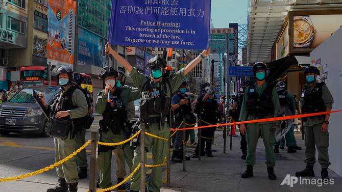 Hong Kongers march on silent protest against countrywide security laws
