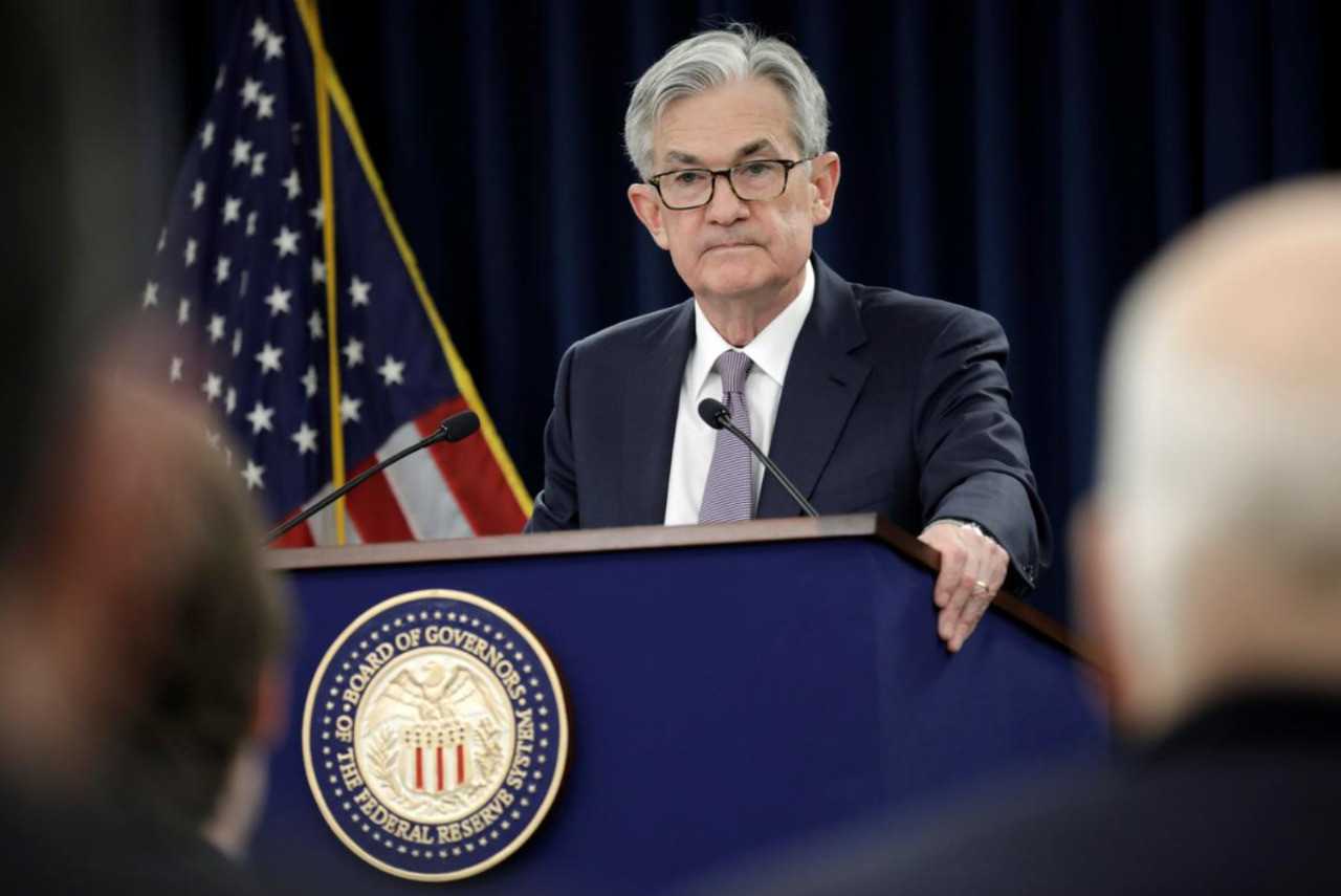 Fed revisits notion of pledging to keep interest rates low