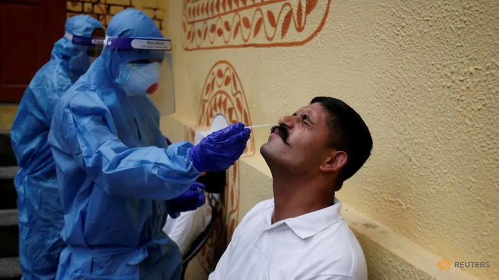 India reports record daily jump of 75,760 COVID-19 infections