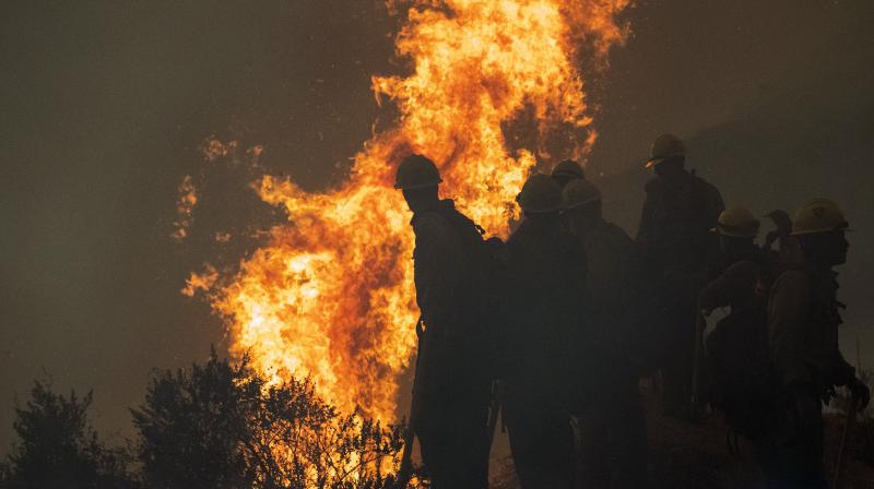 Dozens still missing found in Oregon as weather helps fire figh