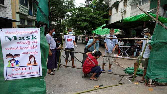 Myanmar residents barricade metropolis streets as COVID-19 cases rise