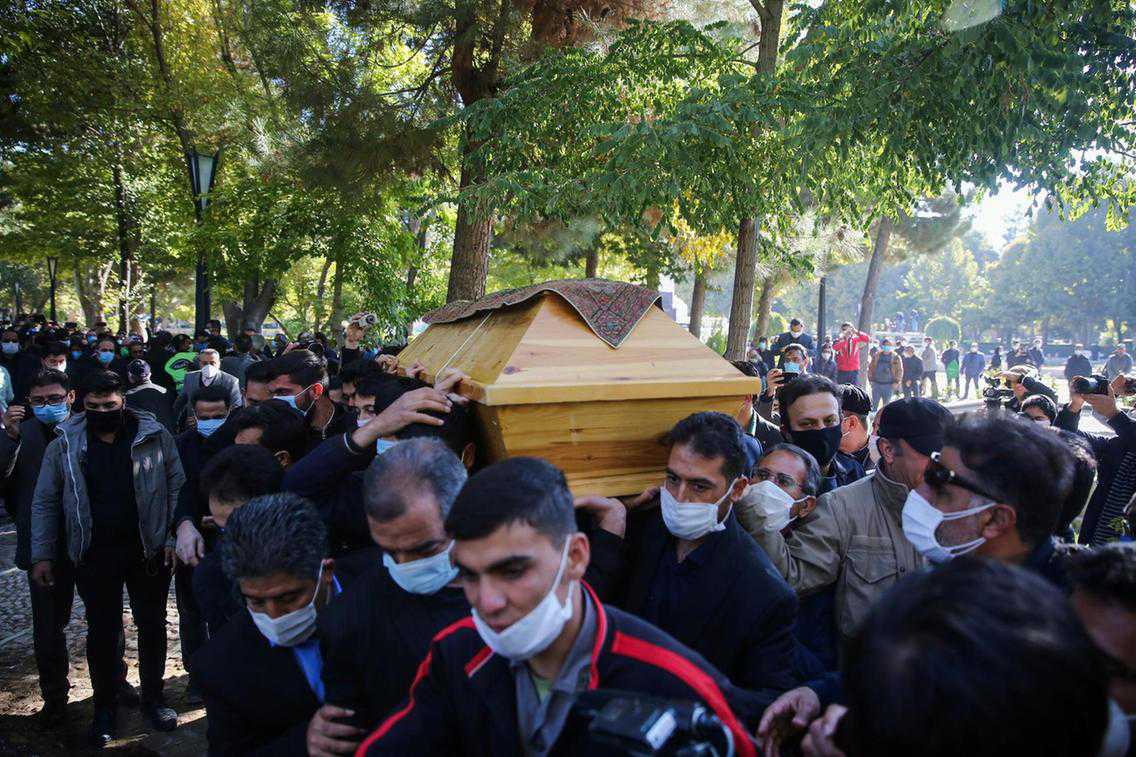 Hundreds of mourners turn out as Iranian composer Mohammad Reza Shajarian is buried near national poet Ferdowsi