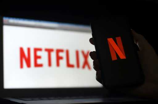 Netflix reports slowing subscriber growth; shares slide