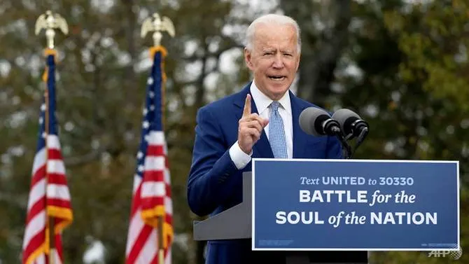 Biden promises to tackle COVID-19 as Trump pushes 'super-recovery'