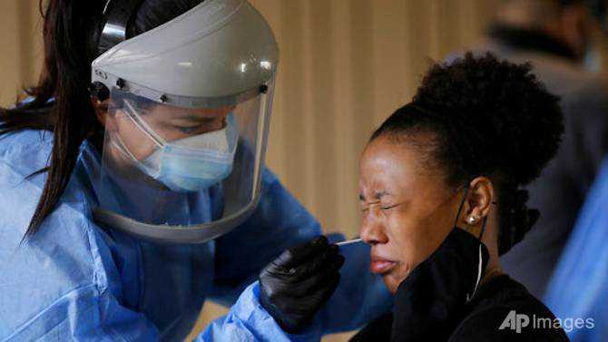 US sets record for COVID-19 cases amid election battle over virus