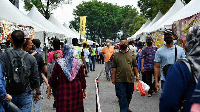 Malaysia reports a lot more than 4,400 new COVID-19 cases; some festive bazaars permitted to keep