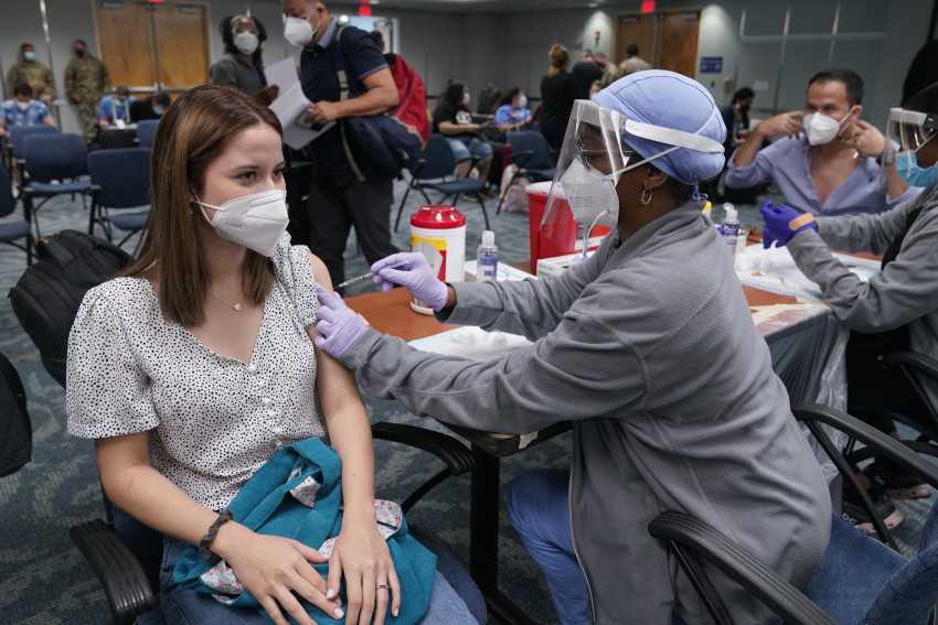 More U.S. says ease lingering virus guidelines as vaccine rates rise