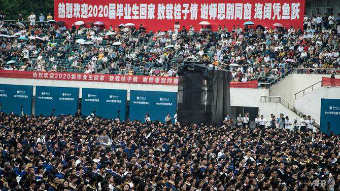 Masks off, mortarboards on: Wuhan sheds COVID-19 for mass graduation